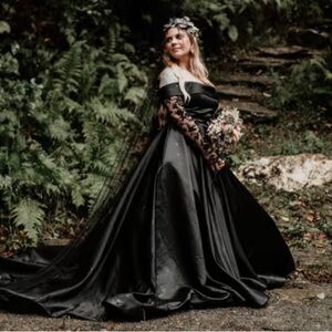 Black satin wedding gown with cathedral veil